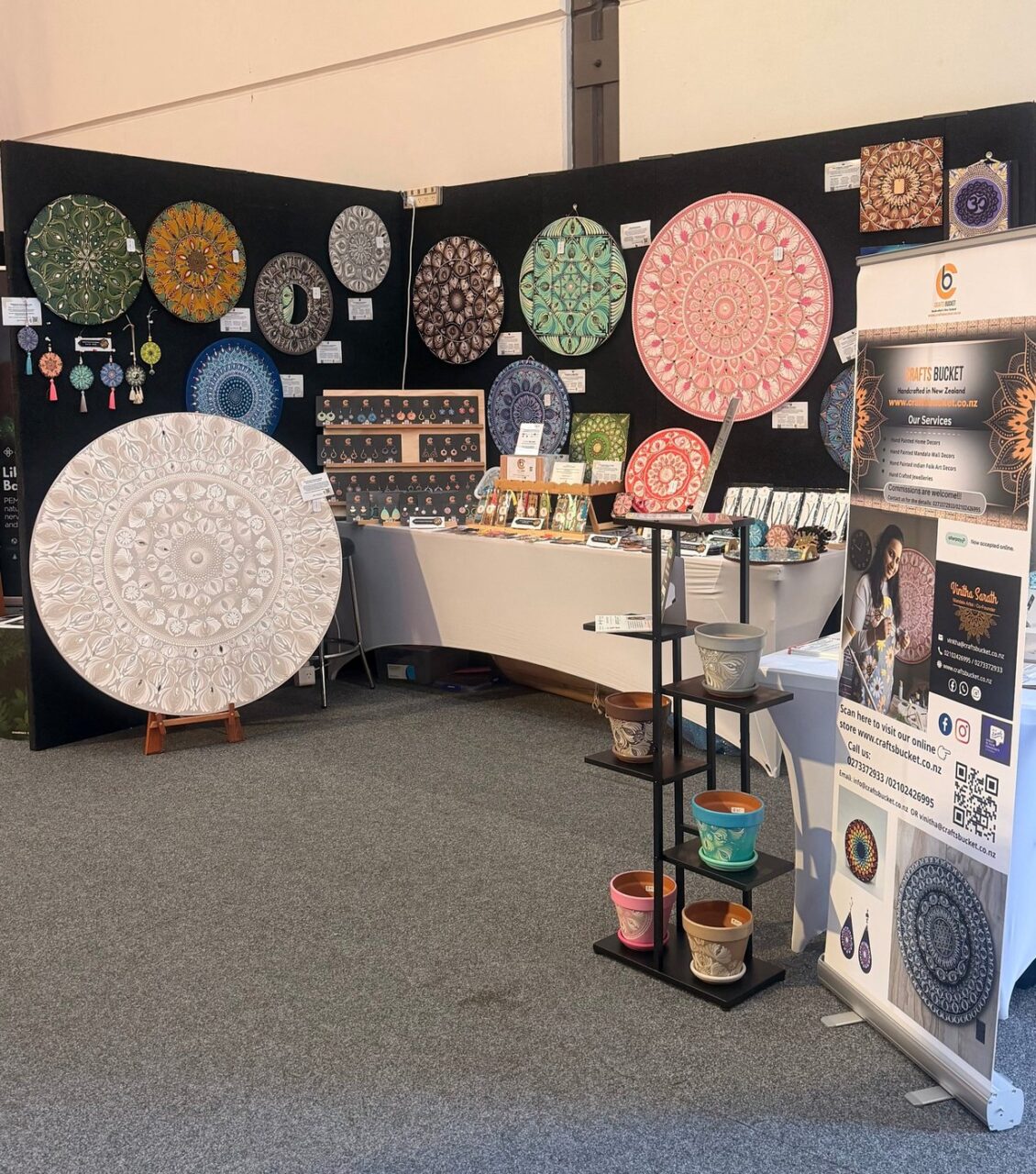 Crafts Bucket - mandala wall art display at an expo stand in Timaru