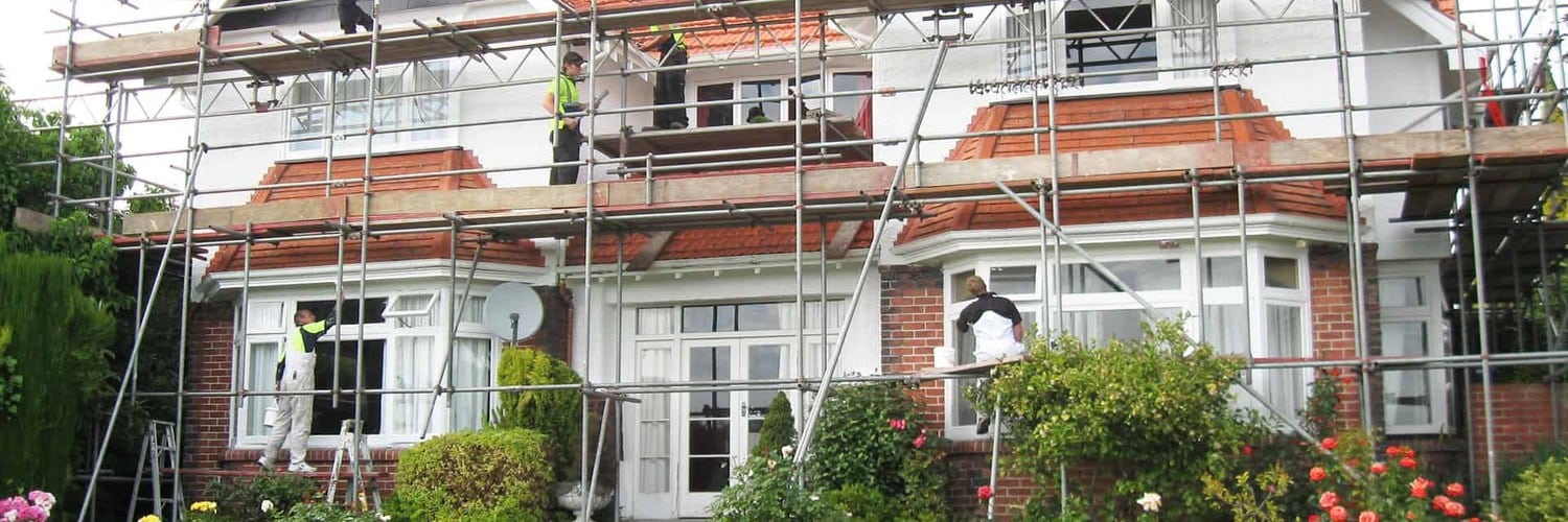 The Busyman - house repaint under scaffolding, handyman in Timaru